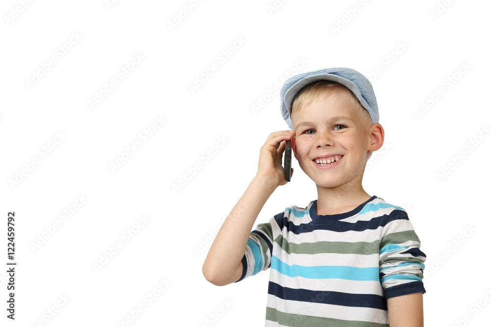 Boy speaks by cell phone and smiling isolated on white background with copy space for text or advertising Boy speaks by cell phone and smiling isolated on white background with copy space for text or advertising