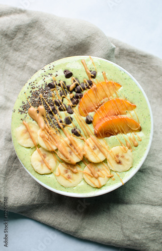 Wallpaper Mural peaches and green spinach smoothie bowl with chocolate chips and chia seeds Torontodigital.ca