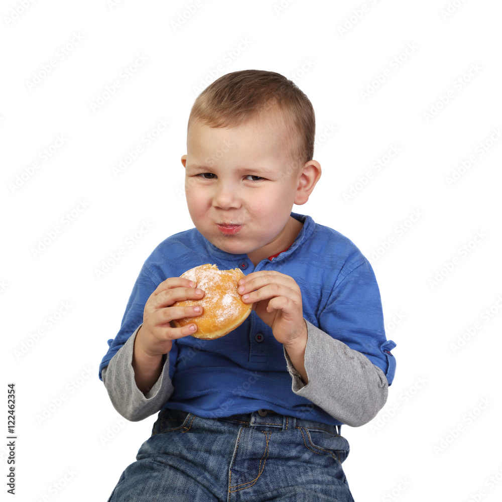 Boy eats buns isolated on white background in square Boy eats buns isolated on white background in square