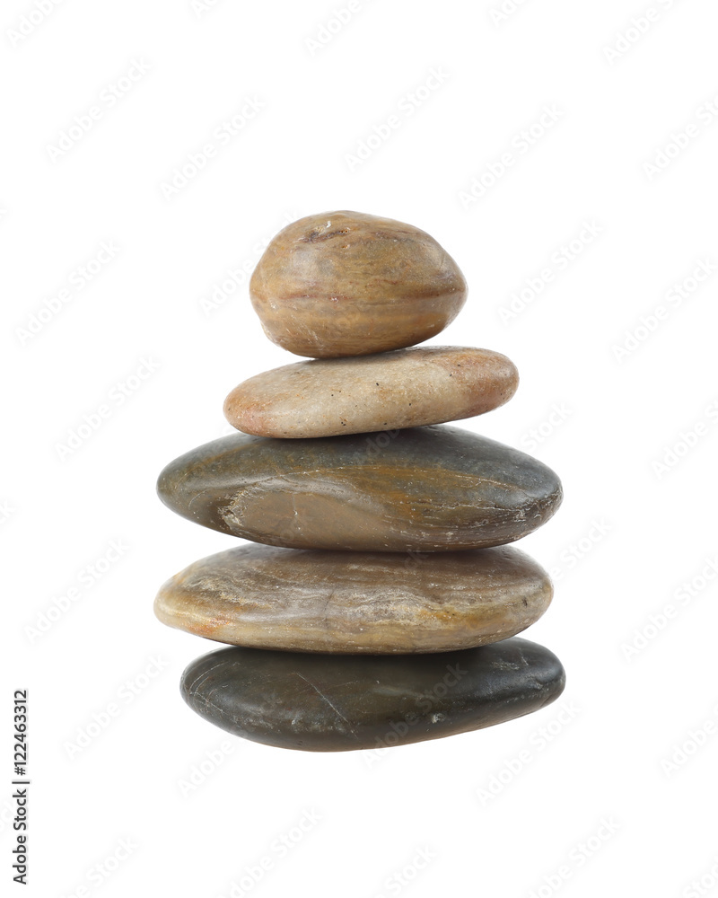 Balanced zen stones in pyramid isolated on white background. Harmony, healthcare and spa concept Balanced zen stones in pyramid isolated on white background. Harmony, healthcare and spa concept