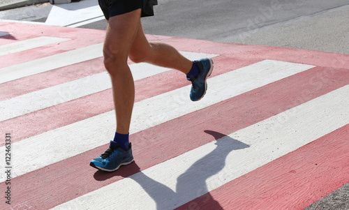 runner during the race on the Pedestrian crossing