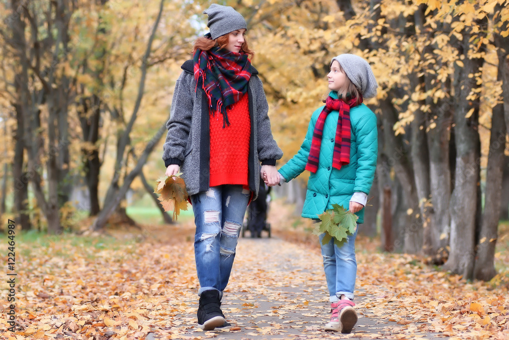 family woman and daughter walk autumn park family woman and daughter walk autumn park