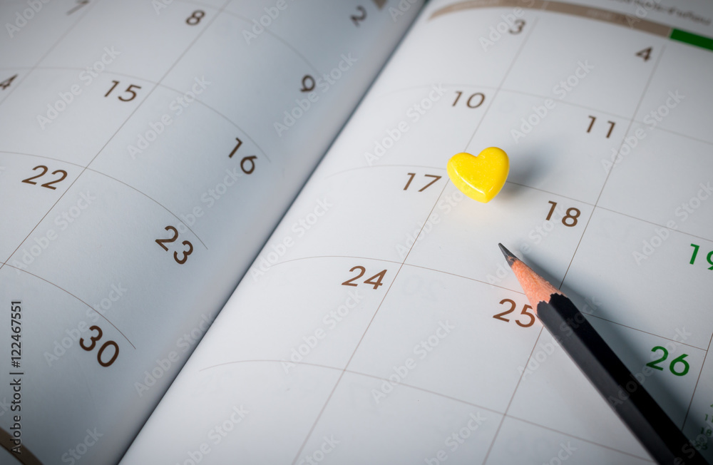 Thumbtack in calendar concept for busy, appointment and meeting