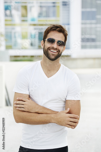 Confident t-shirt guy smiling at camera
