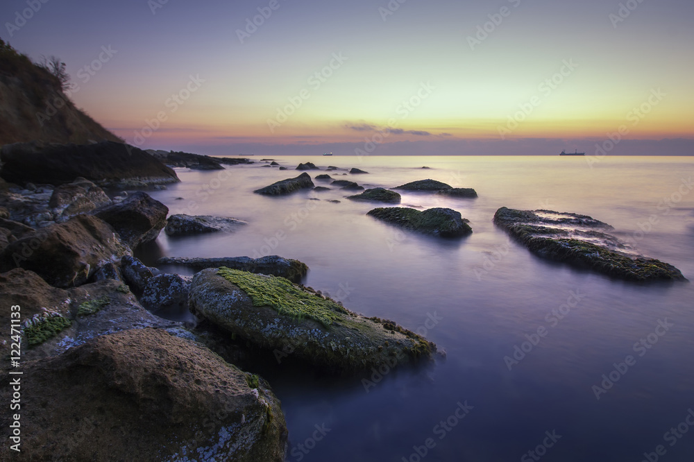 beauty and calm rocky sea before sunrise . beauty and calm rocky sea before sunrise .
