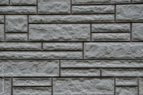 texture of stone masonry, gray background, multi-colored stone b