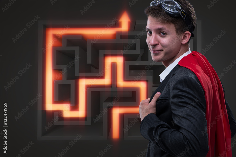 Super hero and maze in business concept Super hero and maze in business concept