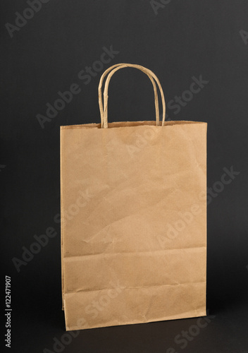 Brown paper bag on a black