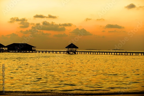 Island in ocean  Maldives. Sunset