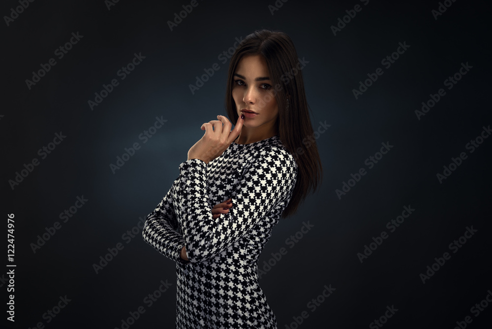 Beautiful brunette girl in black and white dress Beautiful brunette girl in black and white dress