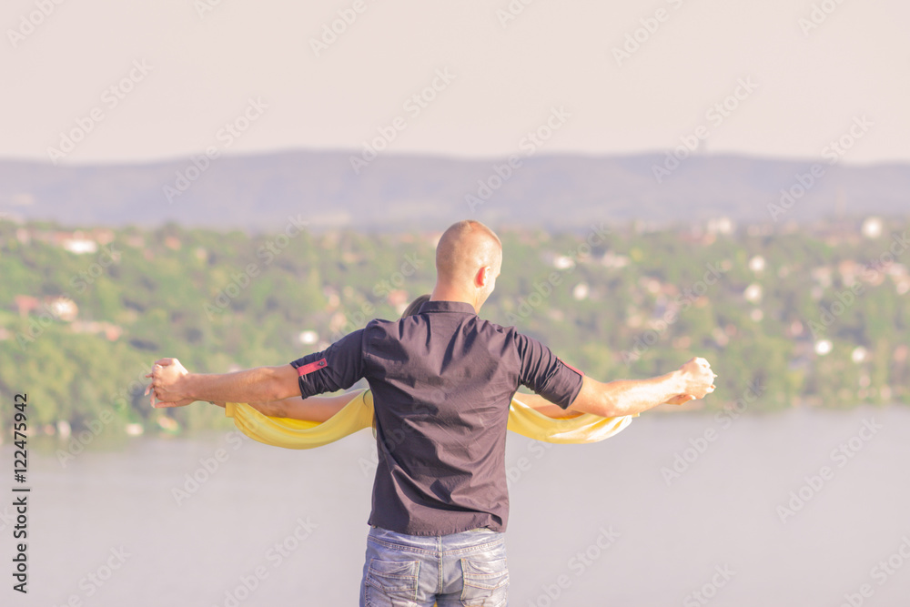 young couple man holding woman hands back rear view young couple man holding woman hands back rear view