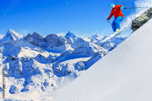 Skiing with amazing view of swiss famous moutains in beautiful w photo