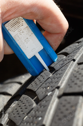 Meassuring the depth of tyre profile photo