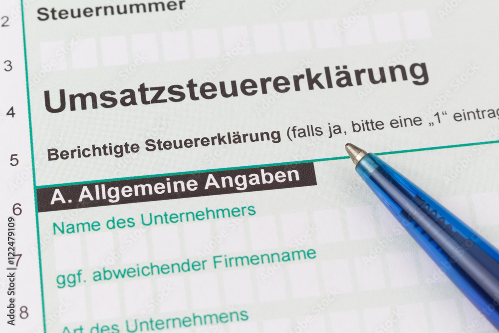 VAT return according german law with blue pen, closeup, low focus