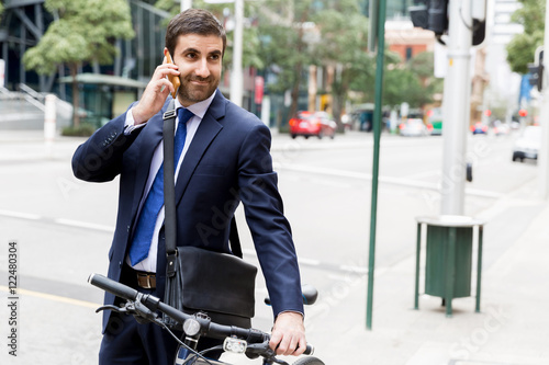 Young businessmen with a bike