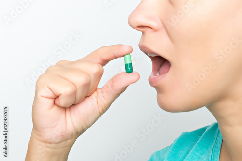 woaman taking pill