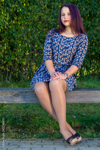 Fashion portrait of young sensual woman in garden