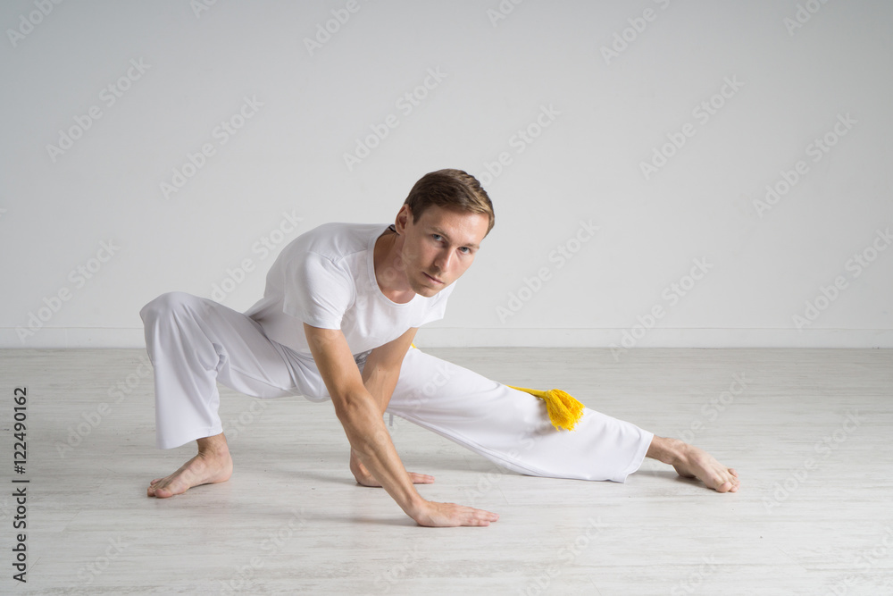 Young man doing stretching exercises