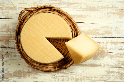 spanish manchego cheese on table photo