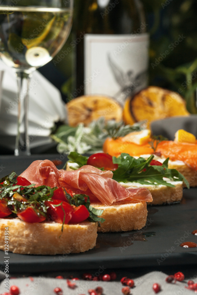 Set bruschetta with fish, greens and meat