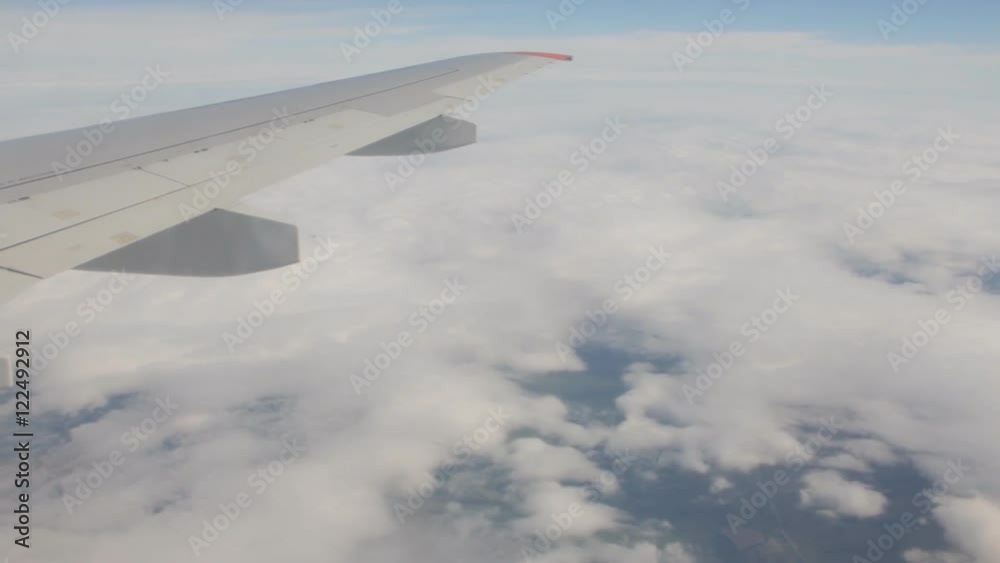 A view of the airplane wing from the airplane window. A view of the airplane wing from the airplane window.