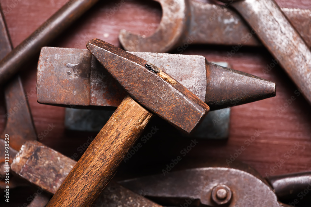 Old rusty rugged anvil, hammer other blacksmith tools. Old rusty rugged anvil, hammer other blacksmith tools.