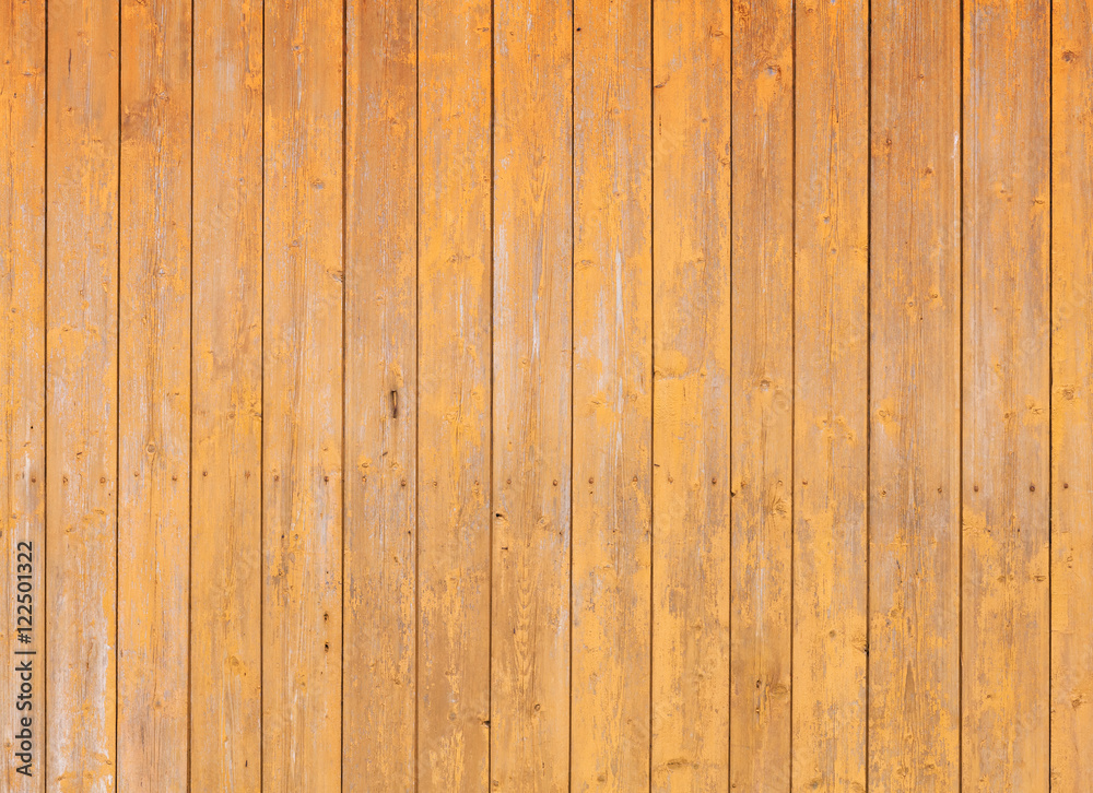 Fototapeta premium Wooden wall with yellow paint layer