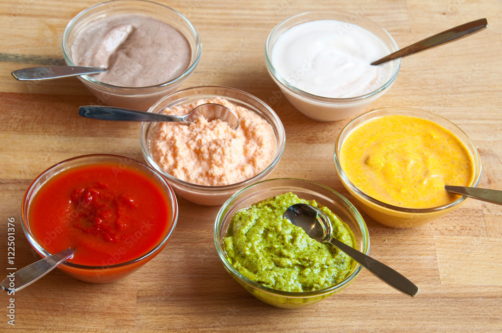 Assorted sauces on wood