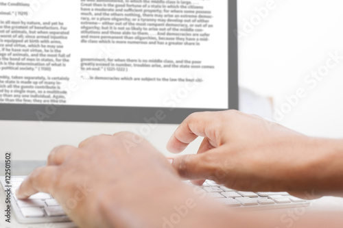 Man using computer, typing text 