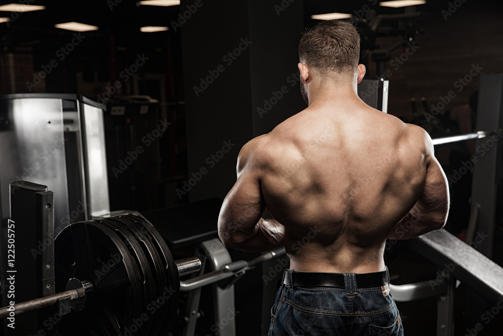 Muscular athletic bodybuilder fitness model posing Muscular athletic bodybuilder fitness model posing