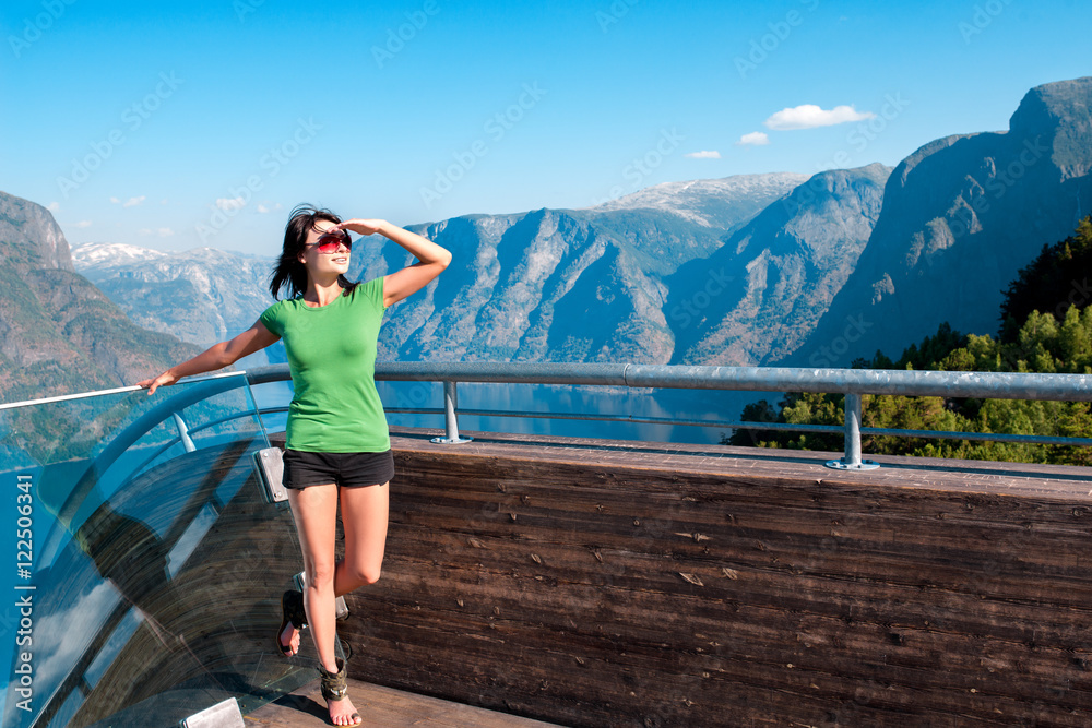 Naklejka premium Woman enjoying scenics from Stegastein Viewpoint