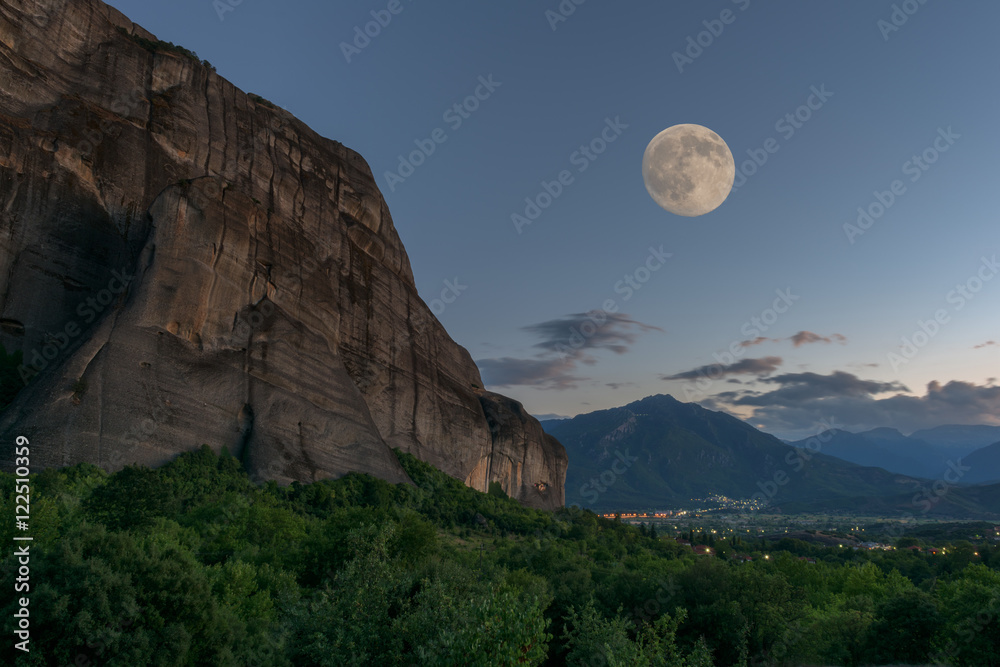 Meteora rock, Thessaly valley, night landscape with full moon