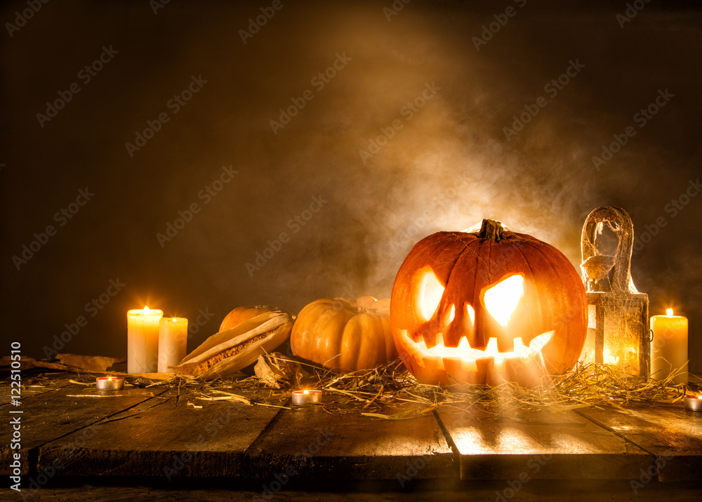 Fototapeta premium Scary halloween pumpkin on wooden planks