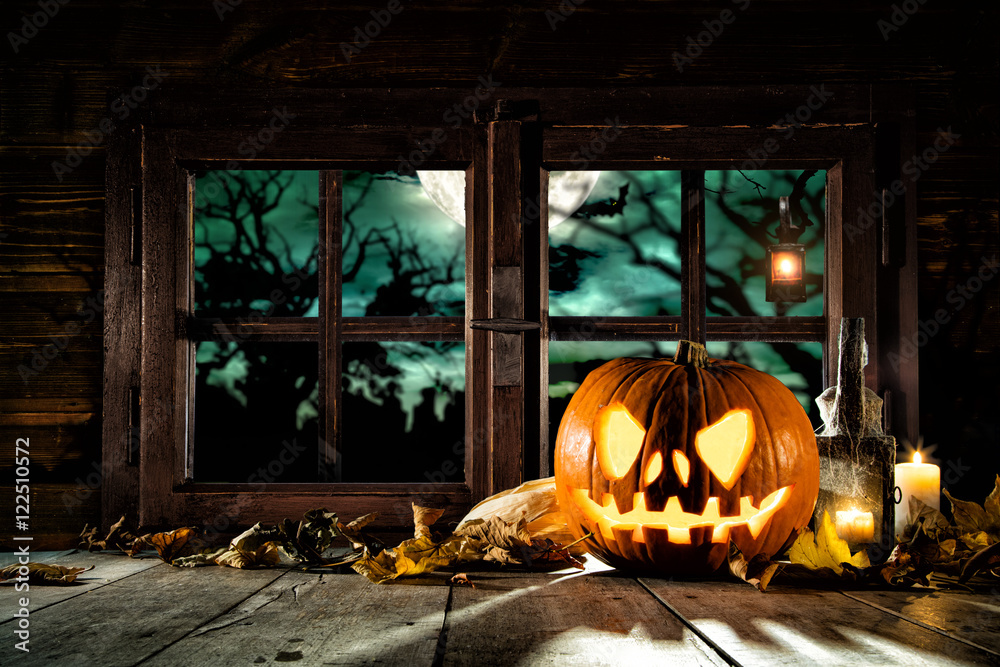 Fototapeta premium Scary halloween pumpkin on wooden planks