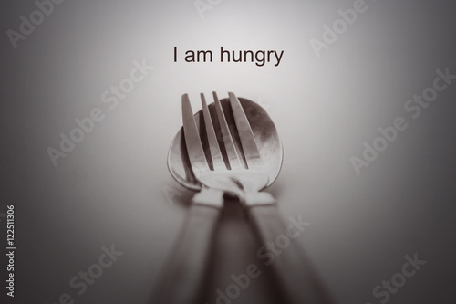 Fork and spoon on white background /i am hungry concept photo