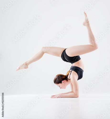 Image of young girl doing acrobatic stunt