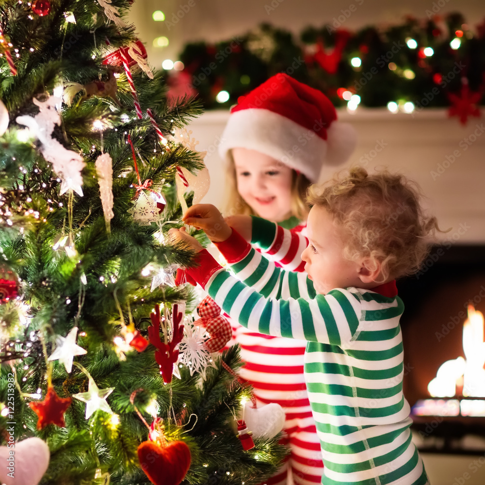 Kids decorating Christmas tree Kids decorating Christmas tree