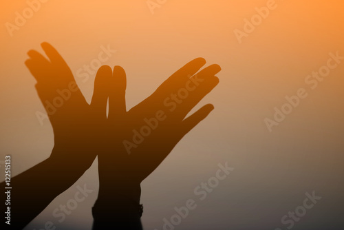 silhouette woman Hand the bird at sunset