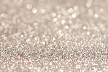 Silver glittering christmas lights. Blurred abstract holiday background