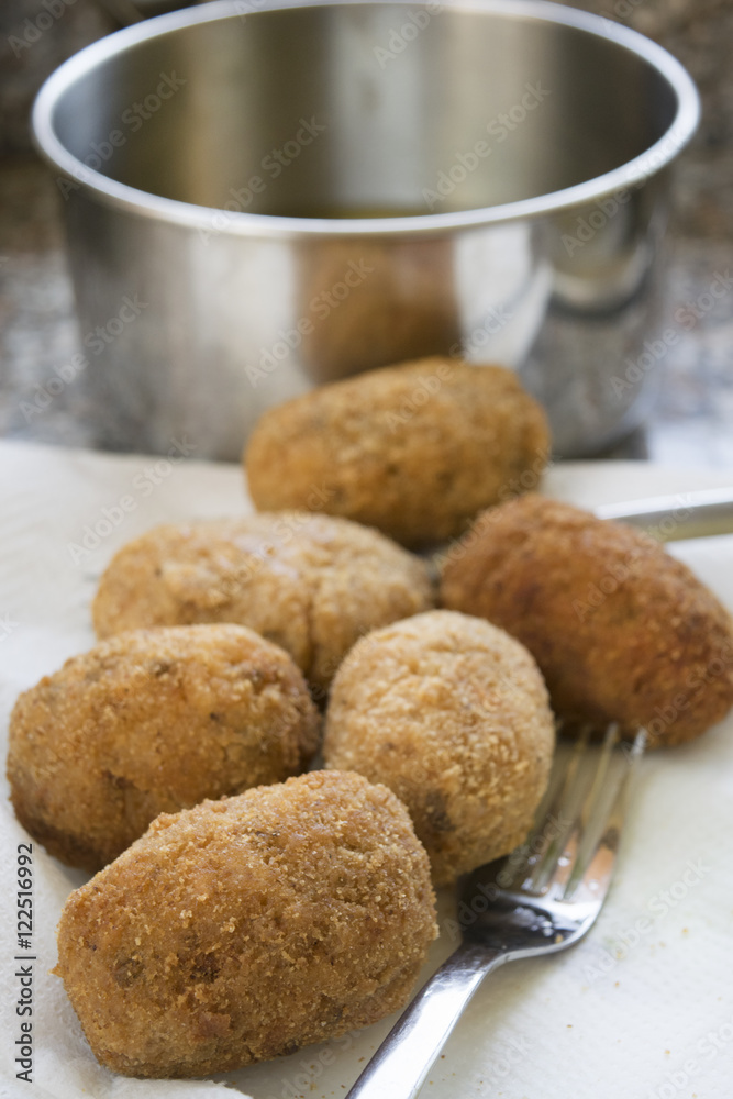 rice balls fried in pan with olive oil