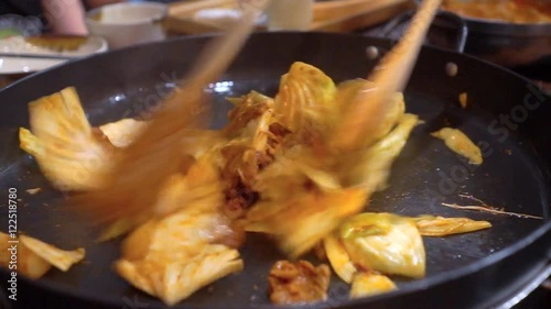 Cooking Korean BBQ pork on hot pan photo