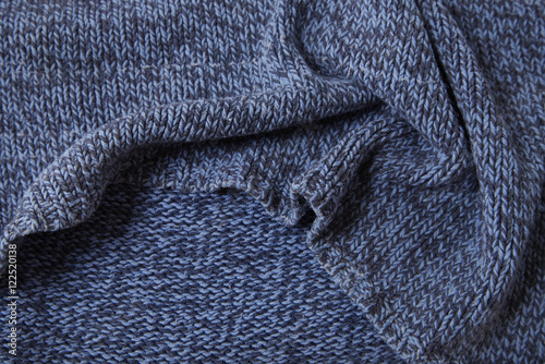 A full page of blue marl knitted background texture