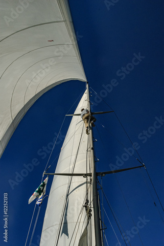 A sailor climbs the mast for repairs.
