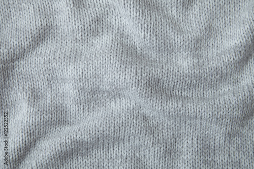 A full page of soft grey knitted sweater background texture