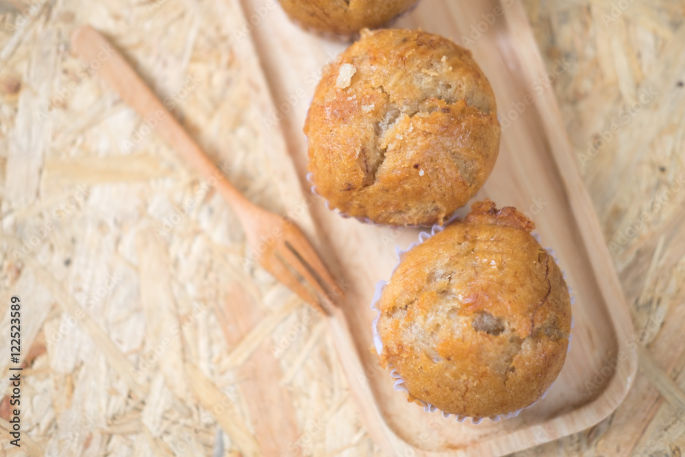 Healthy vegan banana muffins in wood pan. Top view