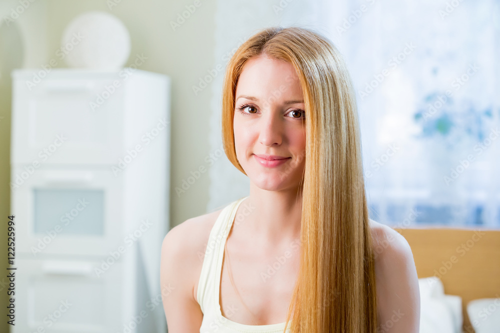 Young beautiful woman with long straightened shiny hair
Young beautiful woman with long straightened shiny hair