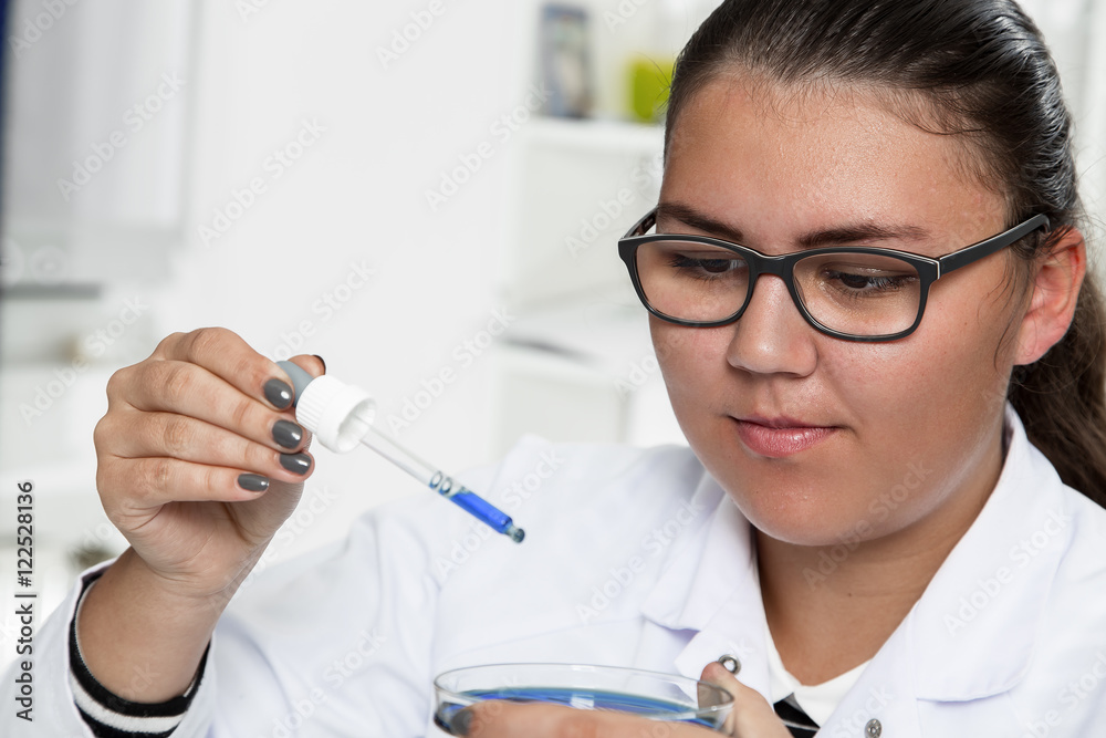 High School student. Student working at laboratory class. High School student. Student working at laboratory class.