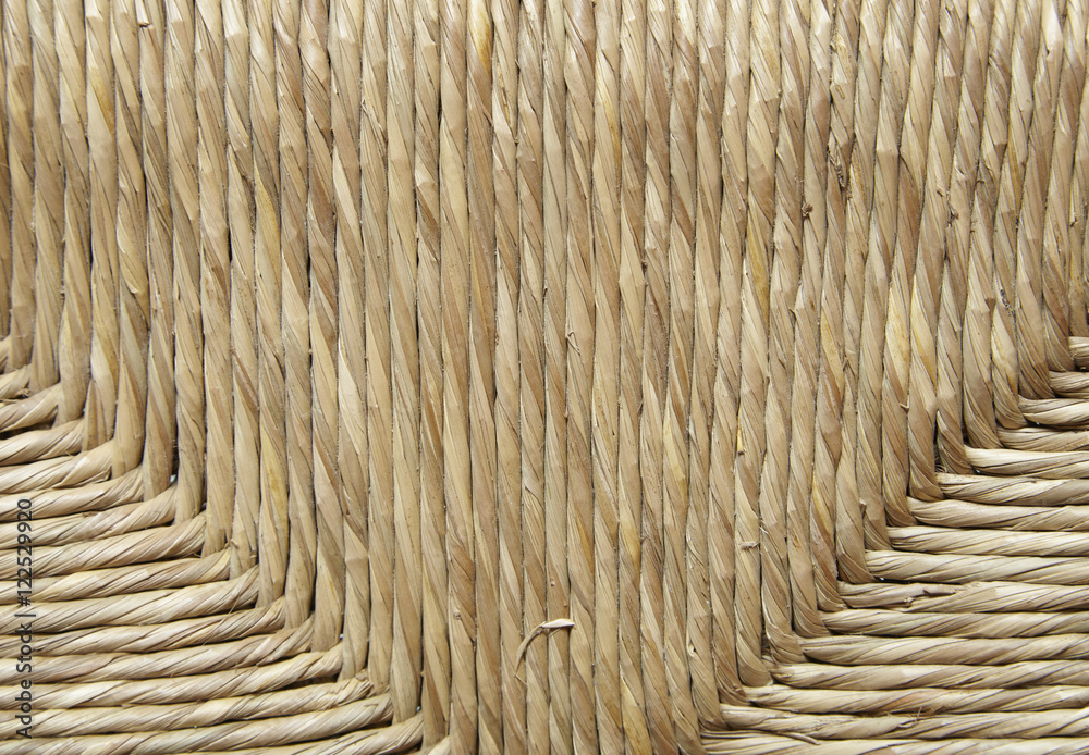 A full page of woven basket seat background texture