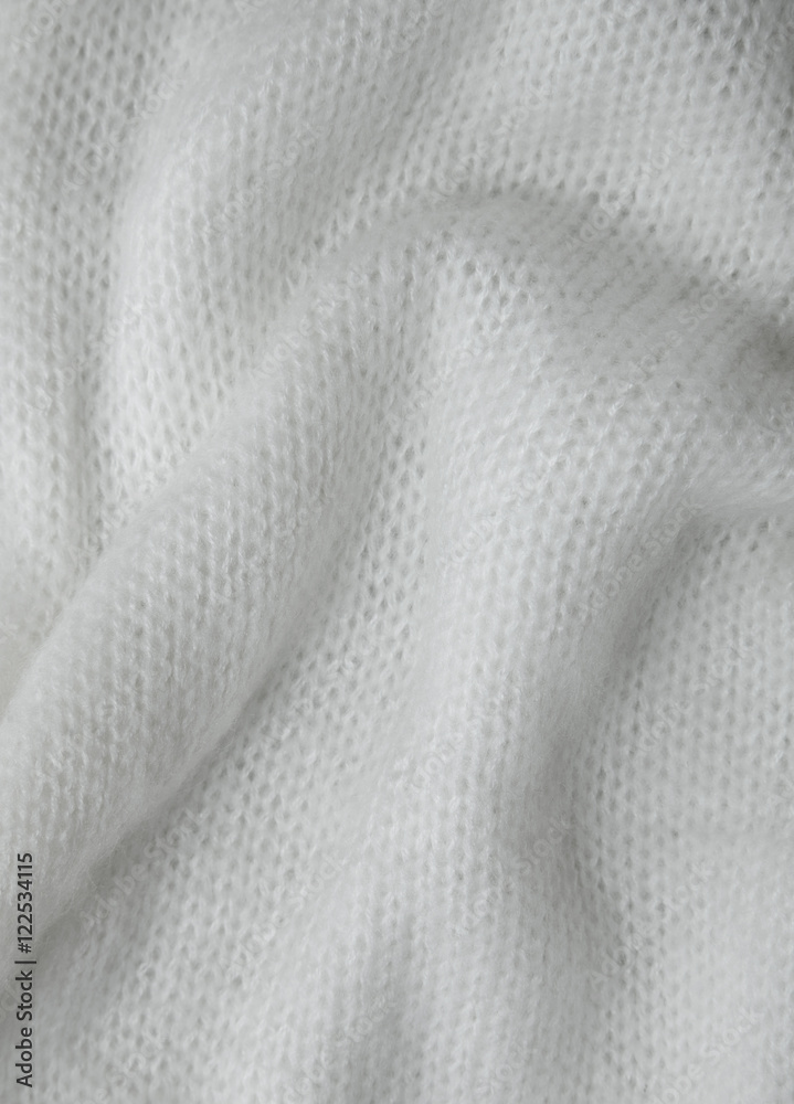 A full page of soft white knitted background texture A full page of soft white knitted background texture
