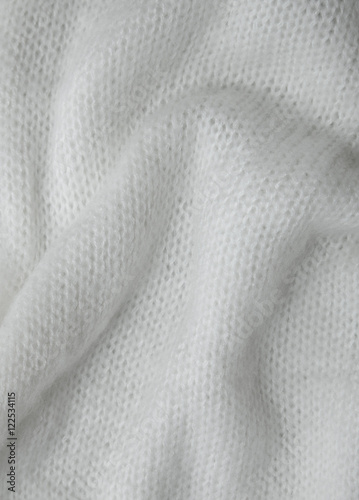 A full page of soft white knitted background texture